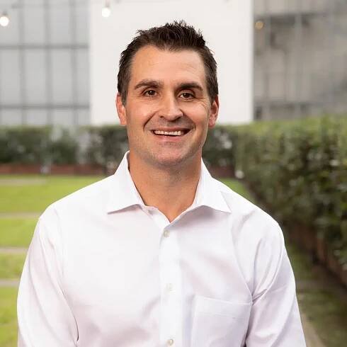Man smiling for his headshot