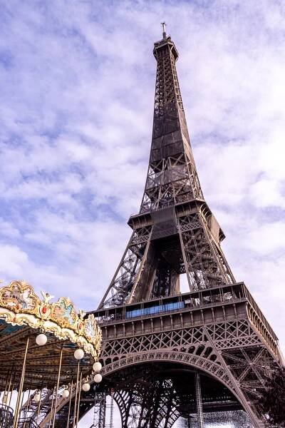 Eiffel Tower Quotes and captions: a beautiful shot up close of the Tour Eiffel with the carrousel in front of it. 