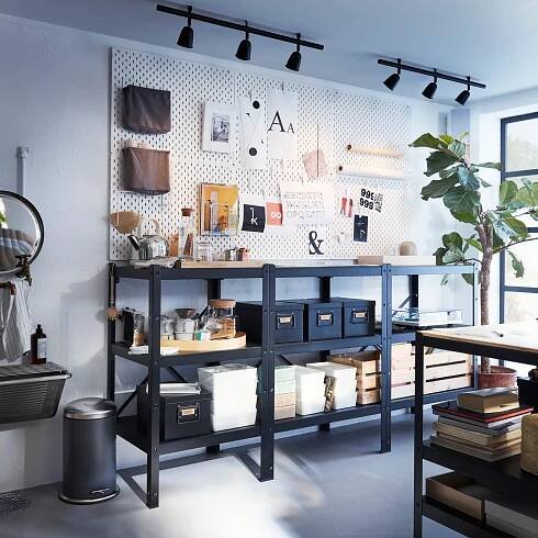 BROR storage shelving solutions in study room or office set up with SKADIS pegboards on wall.