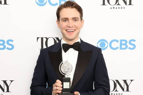 Andrew Burnap, winner of the award for Best Performance by an Actor in a Leading Role in a Play for "The Inheritance" poses in the press room during the 74th Annual Tony Awards at Winter Garden Theatre on September 26, 2021 in New York City.