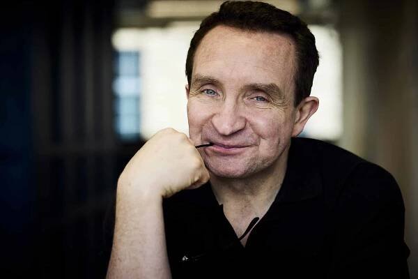 Eddie wears polo by Dunhill.
