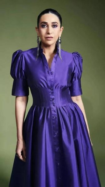 Karisma Kapoor ups the style quotient in a shiny purple shirt dress