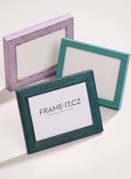 two frames sitting next to each other on a table