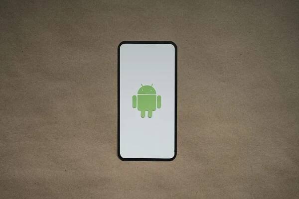 a cell phone with a green icon on it