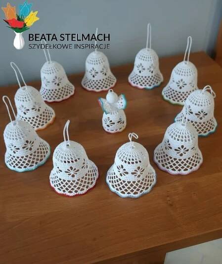 small white crocheted bell ornaments on a wooden table with text overlay that reads, beata steimach