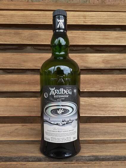 Prestigious Ardbeg Hypernova Whisky on Classic Wooden Bench Wallpaper