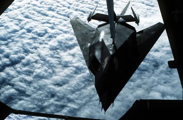 A U.S. Air Force F-117A Nighthawk stealth fighter from the 37th Tactical Fighter Wing refuels from a U.S. Air Force KC-10 Extender aircraft from the 22nd Air Refueling Wing, en route to Saudi Arabia in support of Operation Desert Shield. (U.S. Air Force Photo)