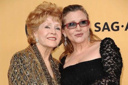 LOS ANGELES, CA - JANUARY 25: Debbie Reynolds and Carrie Fisher pose in the press room at the 21st annual Screen Actors Guild Awards at The Shrine Auditorium on January 25, 2015 in Los Angeles, California. (Photo by Jason LaVeris/FilmMagic)
