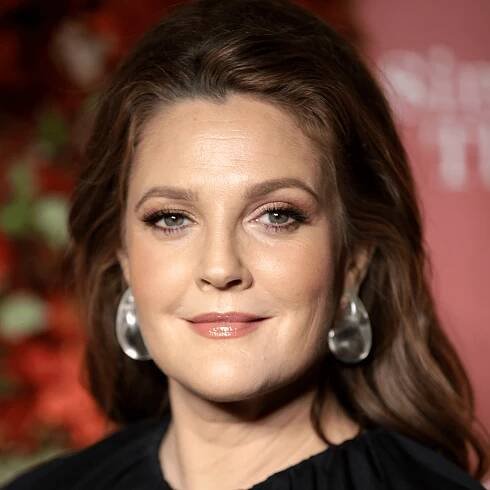 Drew Barrymore wearing pulled back hairstyle