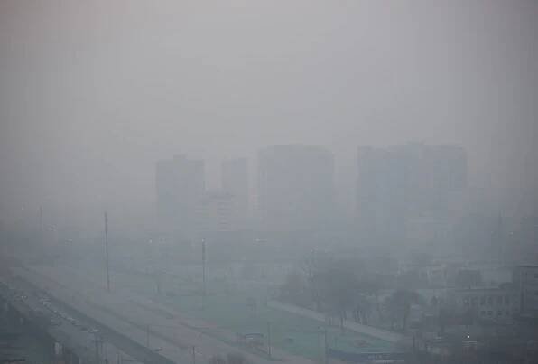 Cities in northeast China were blanketed in thick smog, with the weather bureau issuing orange smog alerts  its second-highest warning  for seven areas in the region.