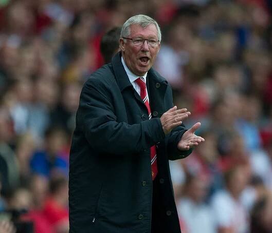 Alex Ferguson coaching during a soccer match.
