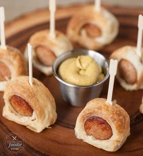 small appetizers with toothpicks and dipping sauce