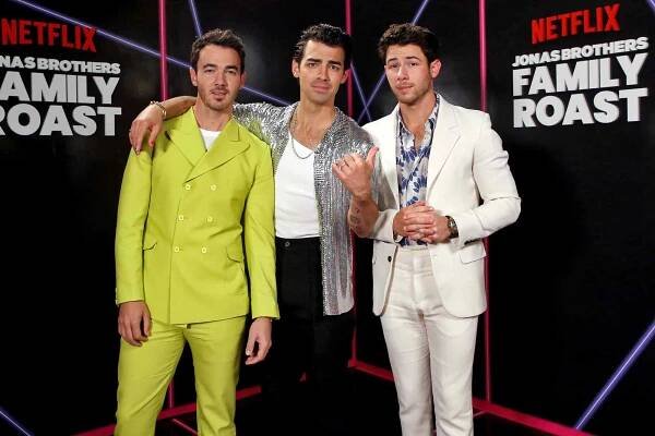 LOS ANGELES, CALIFORNIA - NOVEMBER 23: In this image released on November 23, 2021, (L-R) Kevin Jonas, Joe Jonas and Nick Jonas attend the Jonas Brothers Family Roast Netflix Comedy Special Taping at CBS Television City in Los Angeles, California. (Photo by Phillip Faraone/Getty Images for Netflix)