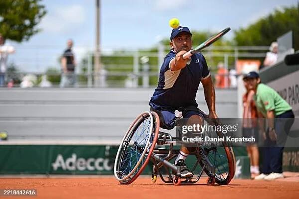 Nicolas Charrier of France in action against Gordon Reid of Great Britain during the Men's Wheelchair Singles First Round match on Day Ten of the...