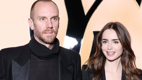 Lily Collins gives a glimpse at her midriff in cropped black waistcoat and floral flares as she...