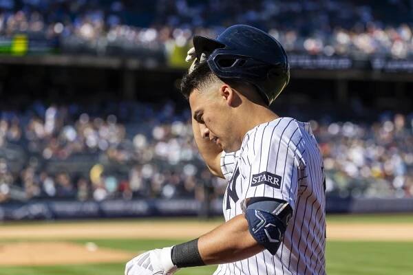 Anthony Volpe #11 of the New York Yankees reacts after grounding out.