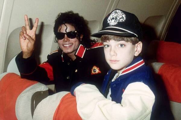 Michael Jackson with 10 year old Jimmy Safechuck on the tour plane on 11th of July 1988