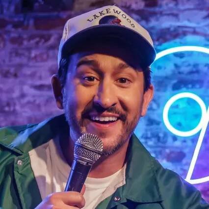 Comedian Dan Davies performing on stage at LMAOF: New York.