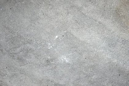 a close up of a gray concrete surface