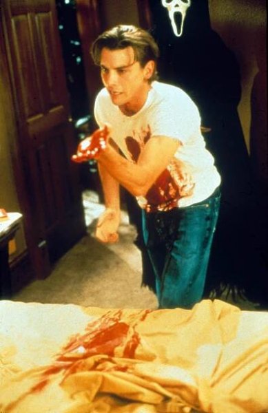 Skeet Ulrich, covered in blood, in a scene from Scream.