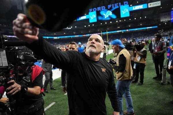 Dan Quinn walks off the field after the Commanders-Lions game on Jan. 18, 2025. 