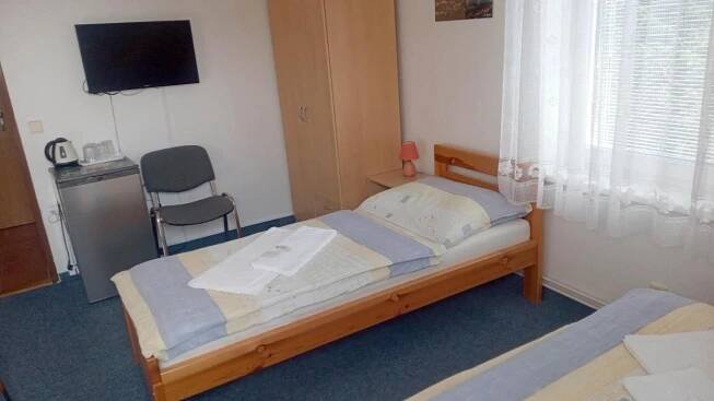 Postel nebo postele na pokoji v ubytování Penzion Pristav