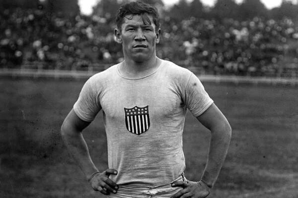 American athlete Jim Thorpe (1888 -1953) at an athletics meeting at the Parc Pommery in Reims, France, 23rd July 1912. Thorpe is competing in the 110 yards Hurdles. BRA-75991. 