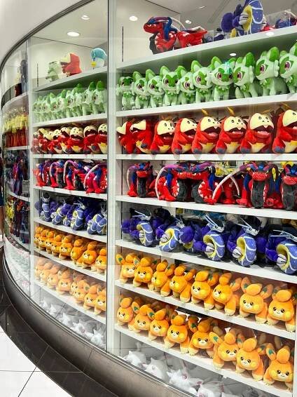 Shelves lined with Pokémon stuffed animals.