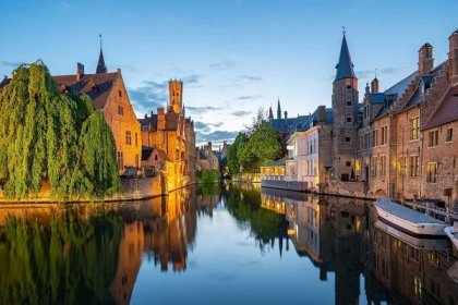 A view across Brugge-Zeebrugge Canal to the Belfry of Bruges in the Belgian city of Bruges.