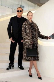 The man of the hour, Michael Kors, posed with Amber Valletta on a white staircase