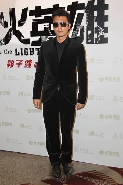 Hongkong zpěvák a herec Nicholas Tse představuje během premiéry pro jeho nový film, jako The světlo jde ven, Hong Kong, Čína, 19. prosince 2013. — Stock obrázek