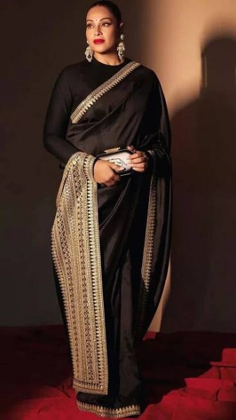 Bipasha Basu captivates in a timeless black satin saree