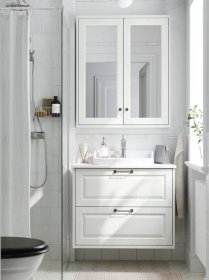 A white bathroom featuring a TÄNNFORSEN wash-stand with drawers and RUTSJÖN semi-recessed wash-basin under a mirror cabinet.