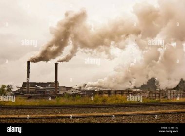 smog and pollution coming from a sugar mill Stock Photo