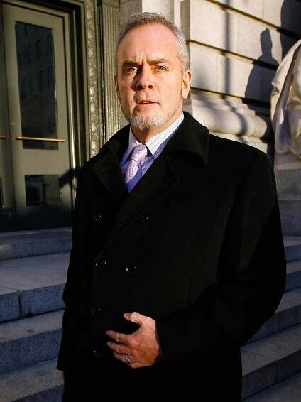 Reality TV star Richard Hatch leaves federal court in Providence, R.I., Wednesday, Dec. 15, 2010. Hatch is charged of violating terms of his probation on his tax evasion sentence. (AP Photo/Stew Milne)