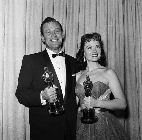 William Holden and Donna Reed at the 26th Annual Academy Awards, Los Angeles, March 25, 1954.