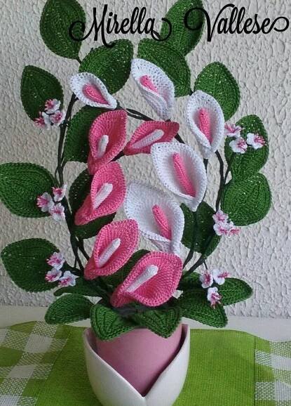 a vase filled with pink and white flowers