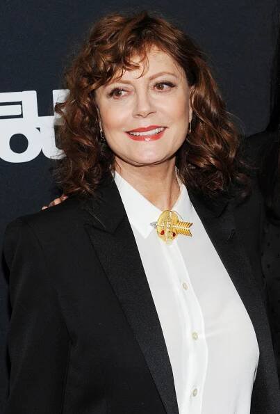Susan Sarandon looks effortlessly chic in a classic black blazer paired with a white blouse, accentuated by a striking gold brooch at the special screening of Thelma & Louise