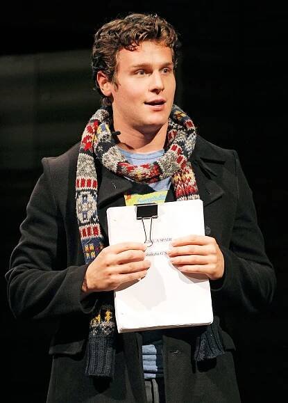 Image may contain Clothing Apparel Human Person Jonathan Groff Scarf Sleeve and Long Sleeve