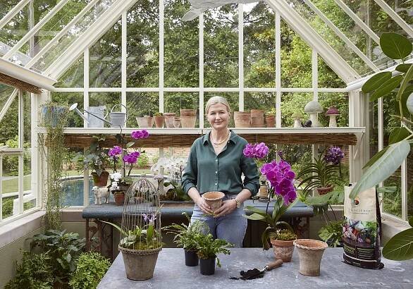 Jenny Sobera working in her greenhouse