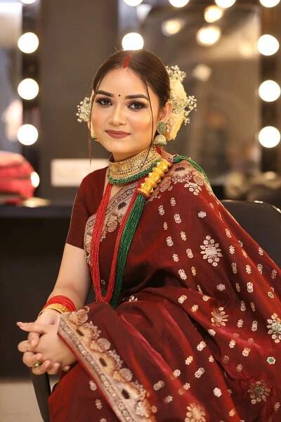 Assamese smiling girl wearing a mekhela chador in Guwahati.