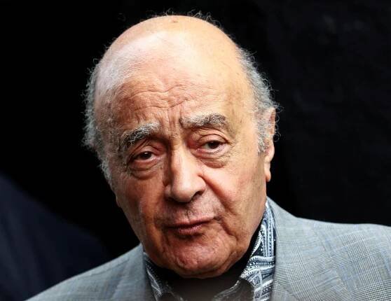 Fulham's chairman Mohamed Al Fayed listens as Fulham's new manager Mark Hughes speaks during a news conference at Craven Cottage stadium in London
