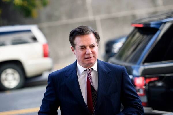 Paul Manafort arrives for a hearing at US District Court on June 15, 2018 in Washington, DC. - Manafort faces charges including conspiracy to launder money and conspiracy against the United States. Manafort was the first to be indicted by Special Counsel Robert Muller's investigation into Russian interference in the 2016 election. Today's hearing includes Manafort's arraignment on new charges concerning attempts to tamper with potential witnesses via an encrypted messaging platform. (Photo by Brendan Smialowski / AFP)        (Photo credit should read BRENDAN SMIALOWSKI/AFP/Getty Images)