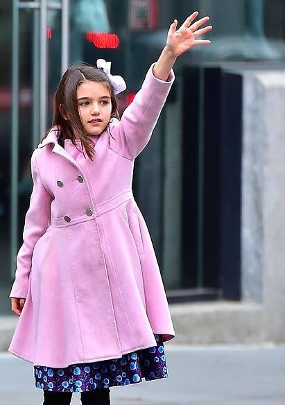 Suri Cruise in a Double-Breasted Pink Coat While Hailing a Taxi in New York City