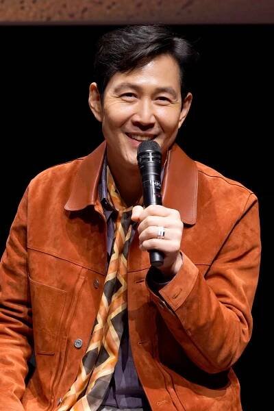 Lee Jung-jae speaks into a microphone at Netflix’s Fall Edit event in Los Angeles