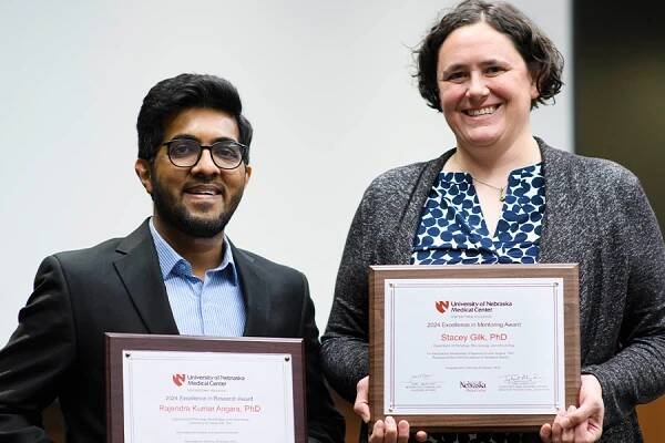 Rajendra Kumar Angara and Stacey Gilk hold their awards
