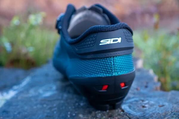 Sidi Dust MTB shoes on a wooden stump
