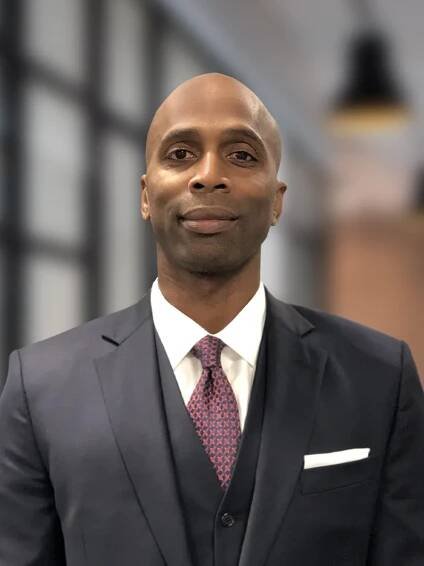 A headshot of Malik Smith, First Vice President and Private Wealth Advisor at Commons Capital.