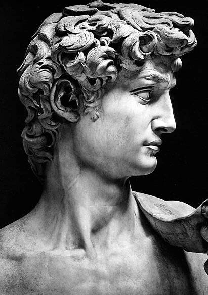 a black and white photo of a statue of a man with curly hair holding a bird in his hand