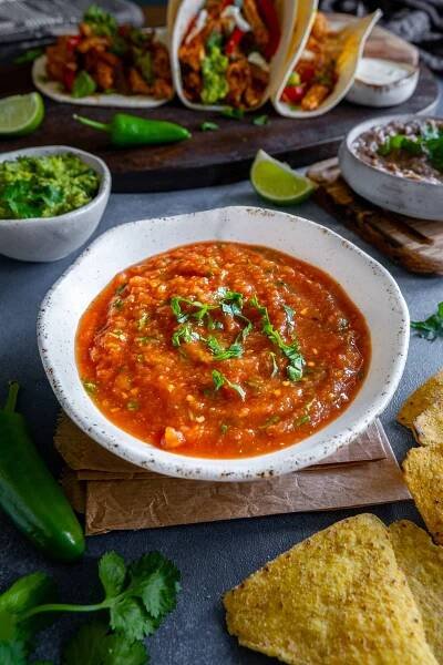 Easy Homemade Salsa (Salsa Roja) with Turkey Fajitas, guacamole and tortilla chips.